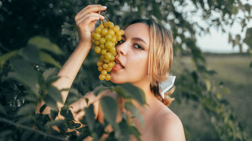 Close-up of woman holding flower