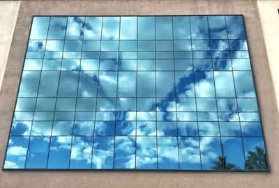 Low angle view of swimming pool against window