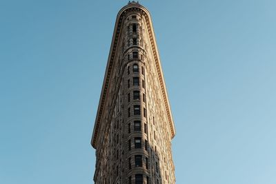 Flat iron building against a clear sky