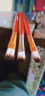 Close-up of paintbrushes on table