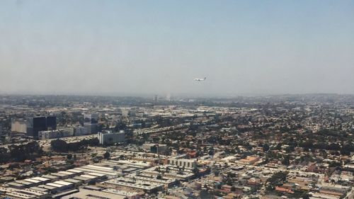 Aerial view of cityscape against sky