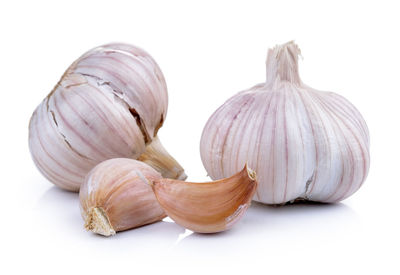 Close-up of garlic against white background