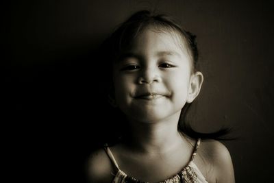 Close-up portrait of smiling girl