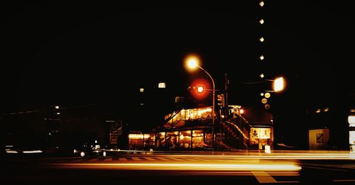 Illuminated city street at night