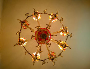 Low angle view of chandelier hanging on ceiling