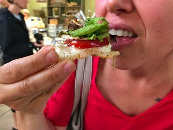 Close-up of woman eating food
