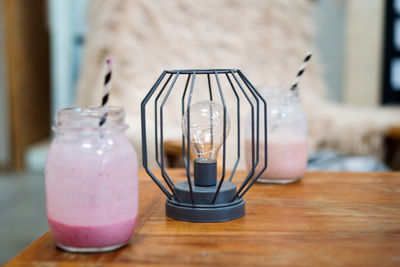 Pink smoothie on the wooden cozy table