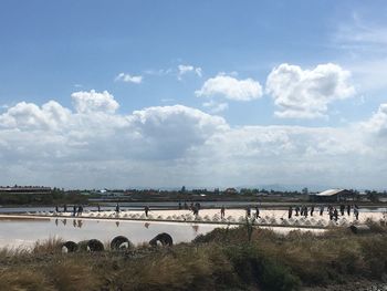 Scenic view of salt field against sky