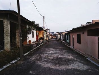 Empty alley amidst buildings in town