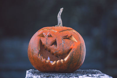 Close-up of jack o lantern on retaining wall