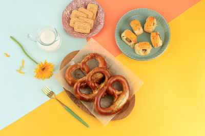 Freshly baked homemade soft pretzel with salt with cookies and cheese sausage pastry