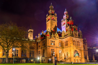 Low angle view of illuminated buildings at night