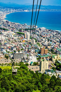 High angle view of townscape by sea