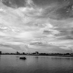 Scenic view of sea against cloudy sky