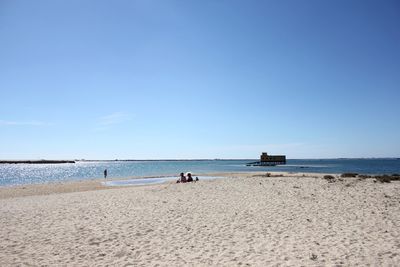 Scenic view of sea against blue sky