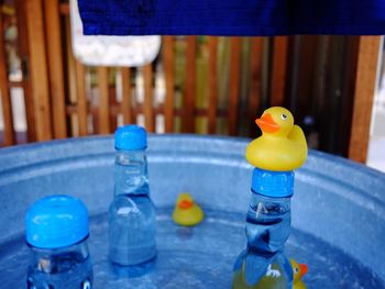 Close-up of yellow toys in water