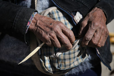 Close-up of hand holding hands