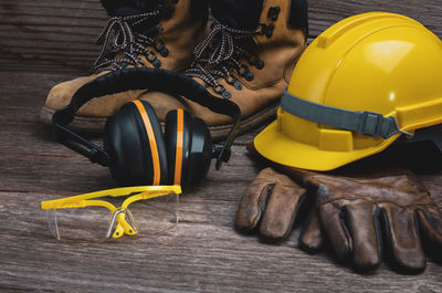 High angle view of yellow hat on table