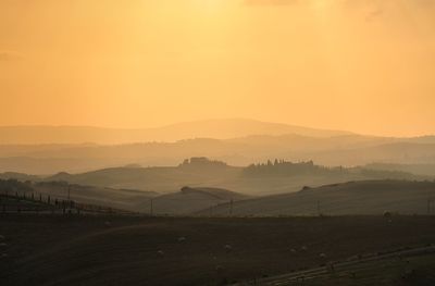 Scenic view of landscape against sky during sunset