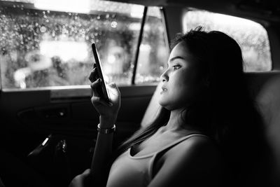 Portrait of woman in car