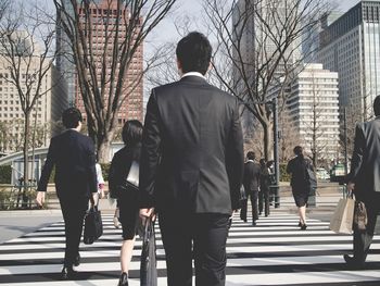 Rear view of woman walking in park