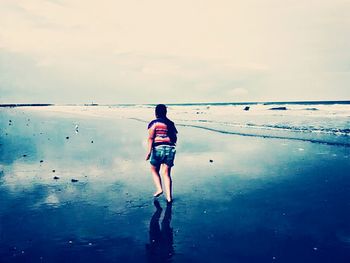 Reflection of woman in water