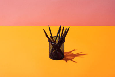 Close-up of pineapple against yellow background