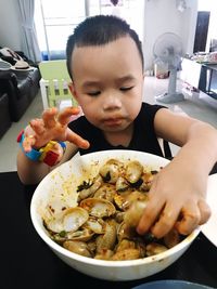 Close-up of boy eating food