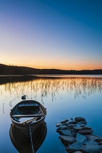 Row boat at lake during sunrise