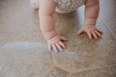 Close-up of child playing on floor at home