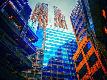 Low angle view of modern buildings against sky