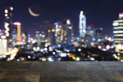 Illuminated city buildings at night