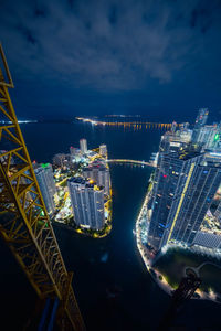 High angle view of illuminated buildings in city at night