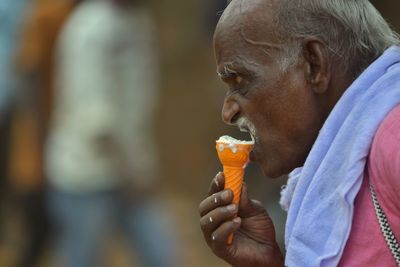 Portrait of man eating food