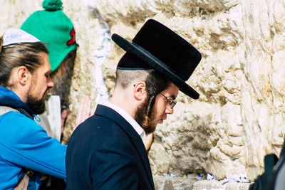 Full length portrait of young man wearing hat