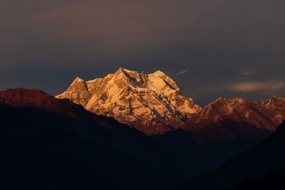 Scenic view of snowcapped mountains against sky