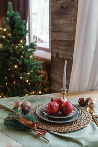 Serving a festive christmas table in scandinavian style. decor on the table before the holiday