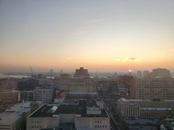 High angle view of buildings against sky during sunset