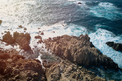 High angle view of rocks in sea