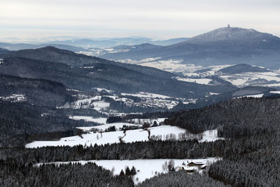 Scenic view of mountains against sky during winter