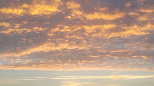 Low angle view of dramatic sky during sunset