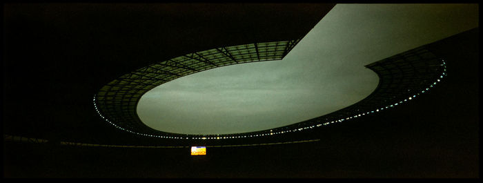 Low angle view of illuminated built structure against sky