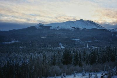 Scenic view of snow covered mountains against sky