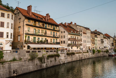 Buildings in city against clear sky