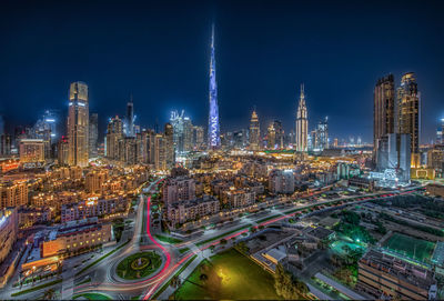 High angle view of illuminated buildings in city at night