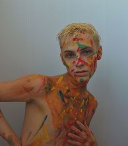 Portrait of young man with face paint