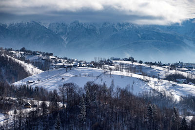 Scenic view of snowcapped mountains against sky