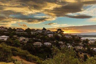 High angle view of city at sunset