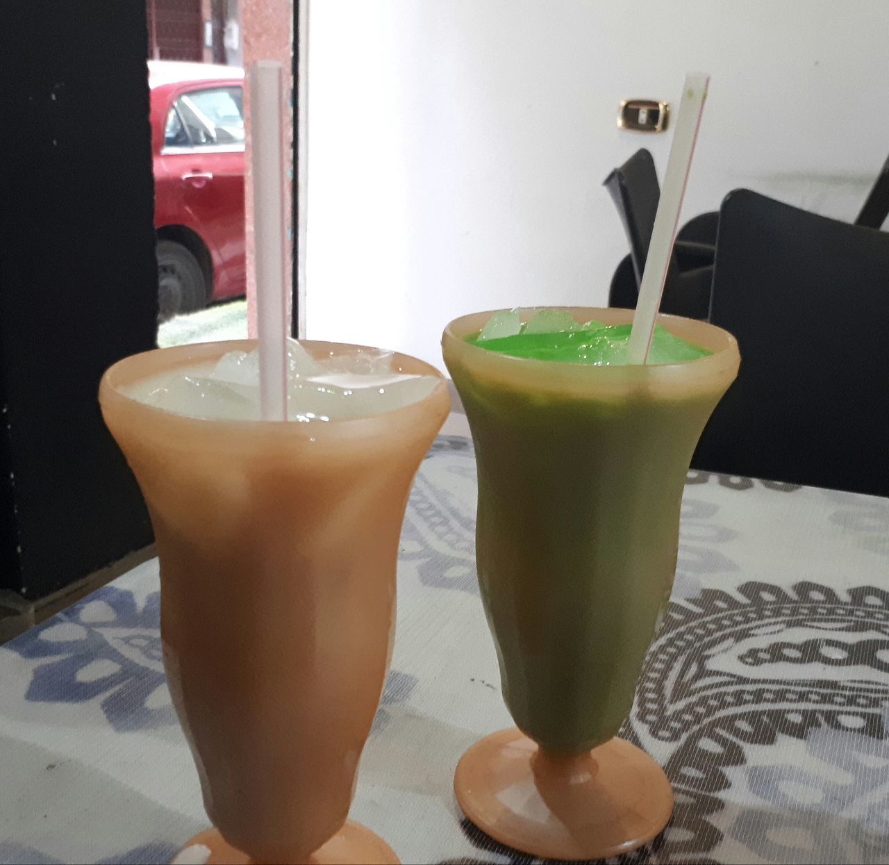 CLOSE-UP OF DRINK WITH JUICE ON TABLE