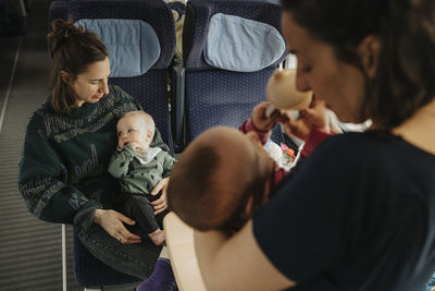 Women traveling with babies by train